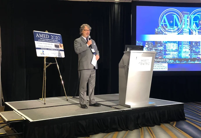 Dr. Linger speaking at a dental education event