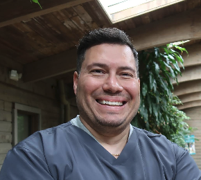 Dr. Barlan Barrero smiling outdoors