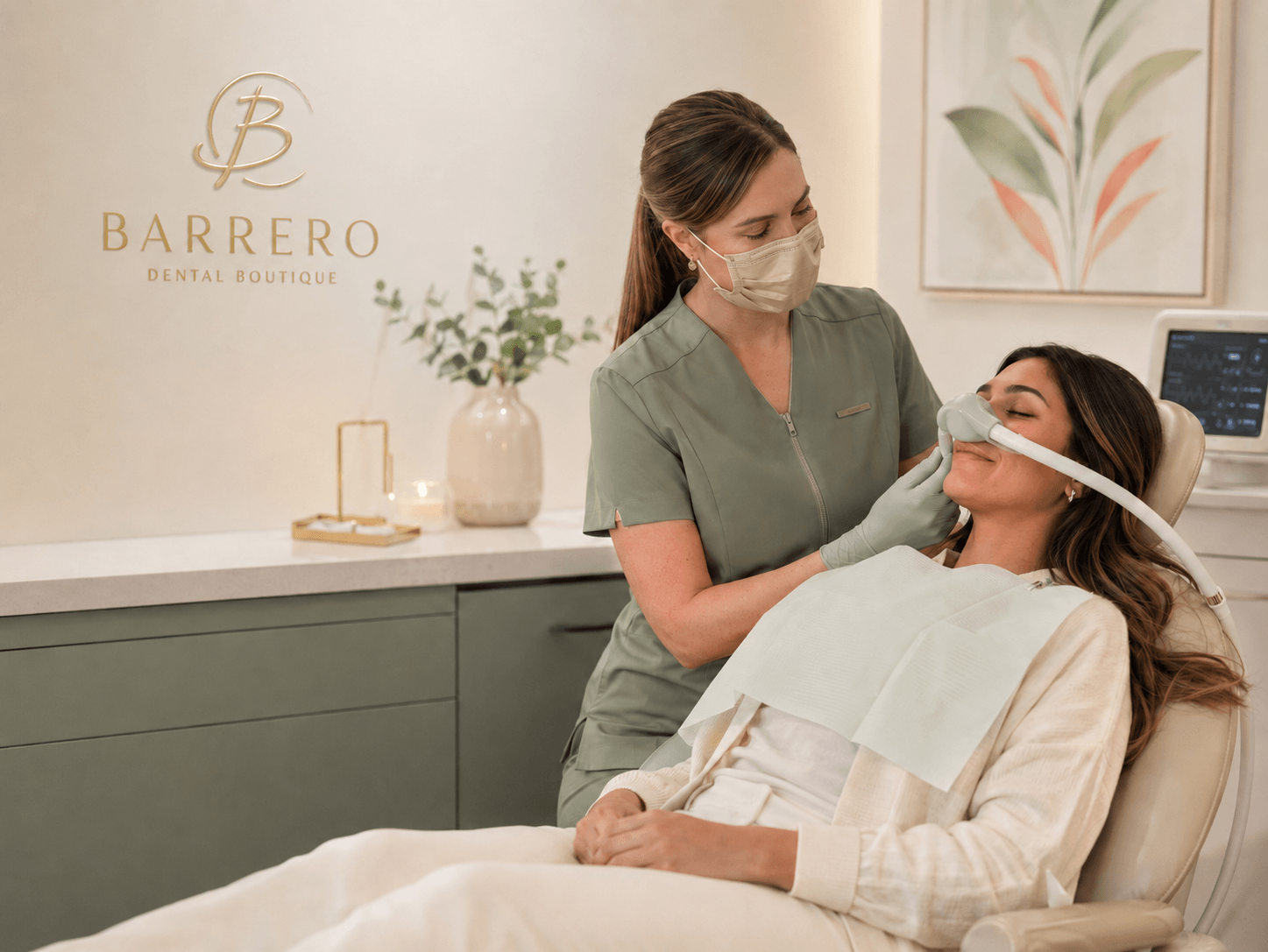 A relaxed patient receiving nitrous oxide support in a warm Barrero Dental Boutique treatment room.